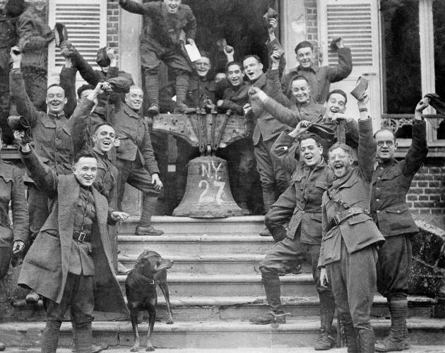 New York troops in Corbie, France, celebrate the signing of the Armistice Treaty, Nov. 11, 1918. New York troops in Corbie, France, celebrate the signing of the Armistice Treaty, Nov. 11, 1918.