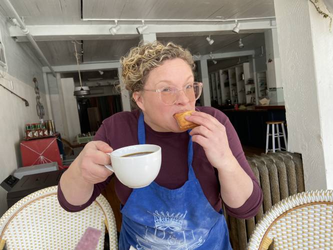 Wesley Janssen, who with her husband Levi owns and runs Wells Provisions in Charlemont, enjoying a freshly made beignet.