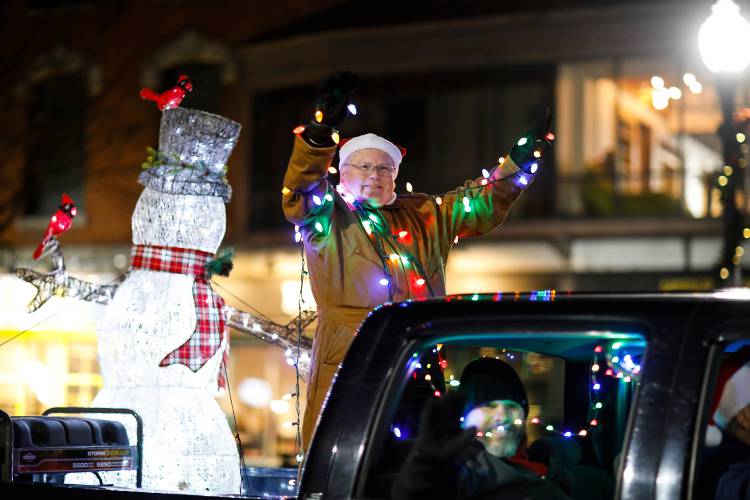 Illuminated vehicles and humans make their way down Main Street during the Parade of Lights to kick off Greenfield’s Winter Carnival in 2020. The 102nd annual event returns Friday through Sunday.