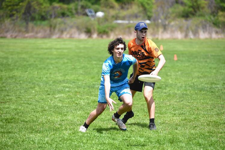 Four Rivers’ Caleb Bird Richards makes a pass against Newton North in the Four Rivers Ultimate Tournament in Greenfield Saturday.