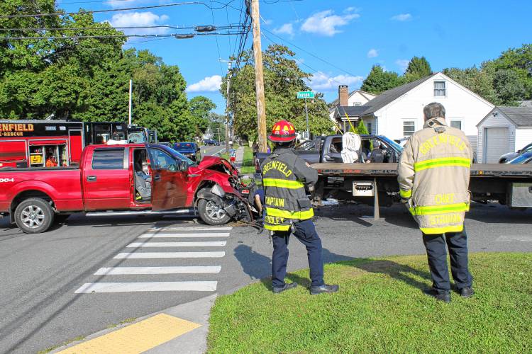 Police and firefighters respond to the intersection of Country Club Road, Silver Street and Vernon Street in Greenfield on Friday afternoon following a three-vehicle collision.