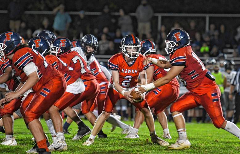 Frontier’s Garett Dredge fakes the hand off against Franklin Tech in South Deerfield Friday night. 