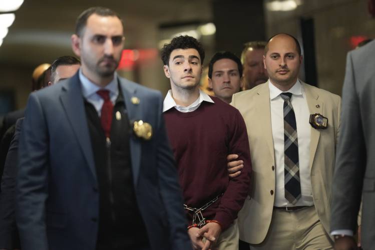 Luigi Mangione is escorted into Manhattan Criminal court for his arraignment on state murder and terror charges in the killing of UnitedHealthcare CEO Brian Thompson, Monday, Dec. 23, 2024, in New York. Luigi Mangione is escorted into Manhattan Criminal court for his arraignment on state murder and terror charges in the killing of UnitedHealthcare CEO Brian Thompson, Monday, Dec. 23, 2024, in New York.