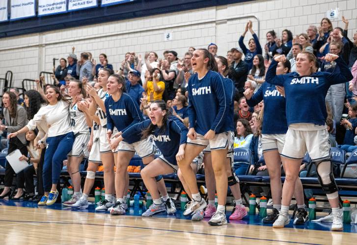 The Smith bench erupts with cheers after a play during the NCAA Division 3 Women's Basketball tournament Round of 32 game against Amherst at Ainsworth Gym, Saturday, March 8, 2025, in Northampton.