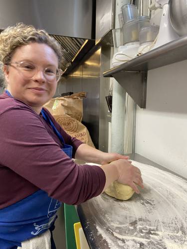 After letting the dough rest in the fridge for (ideally) 24 hours, it’s important to knead the dough to “wake up” the yeast, as demonstrated here by Wesley Janssen.