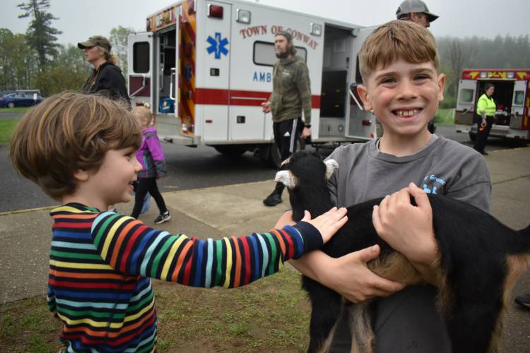 Isaac Merritt, 5, and Fredrick Sweet, 8, spent time with Billy Bob, a goat from Conway’s Wholey Cow Farm, at the third annual Spring Fling.