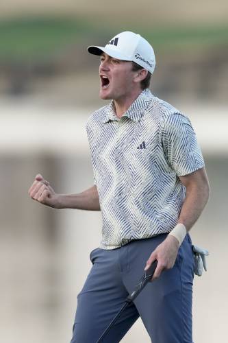 Nick Dunlap reacts after making his putt on the 18th hole of the Pete Dye Stadium Course during the final round to win the American Express golf tournament, Sunday, Jan. 21, 2024, in La Quinta, Calif. (AP Photo/Ryan Sun)