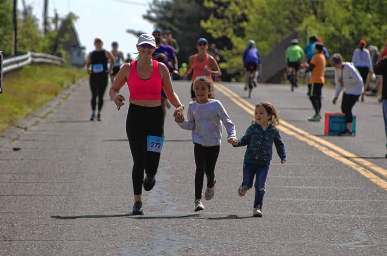 Runners make their way through the WMass Mother's Day Half Marathon in Whately last year. The 14th annual event returns to the area on Sunday. Runners make their way through the WMass Mother's Day Half Marathon in Whately last year. The 14th annual event returns to the area on Sunday.