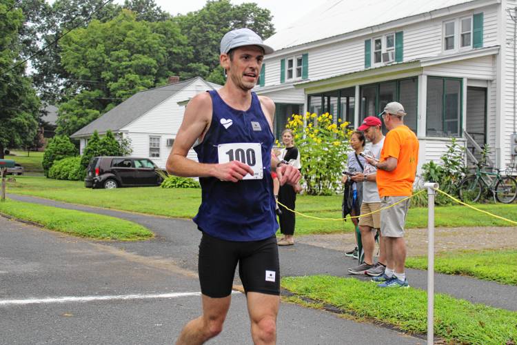 Overall Mug Race winner and mens division winner Michael Keebler crossing the finish line with a time of 30 minutes and 14 seconds. The Montague resident has now won the 5.5 mile race twice in a row. 
