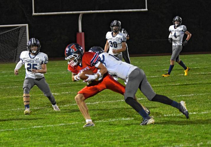 Frontier’s Ty Skroski hauls in a pass against Franklin Tech in South Deerfield Friday night. 