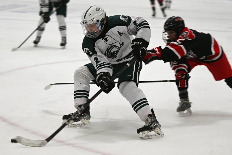 Greenfield’s Jake Jurek moves the puck up the ice against Westfield at Collins Moylan Ice Skating Arena in Greenfield earlier this season. Greenfield’s Jake Jurek moves the puck up the ice against Westfield at Collins Moylan Ice Skating Arena in Greenfield earlier this season.