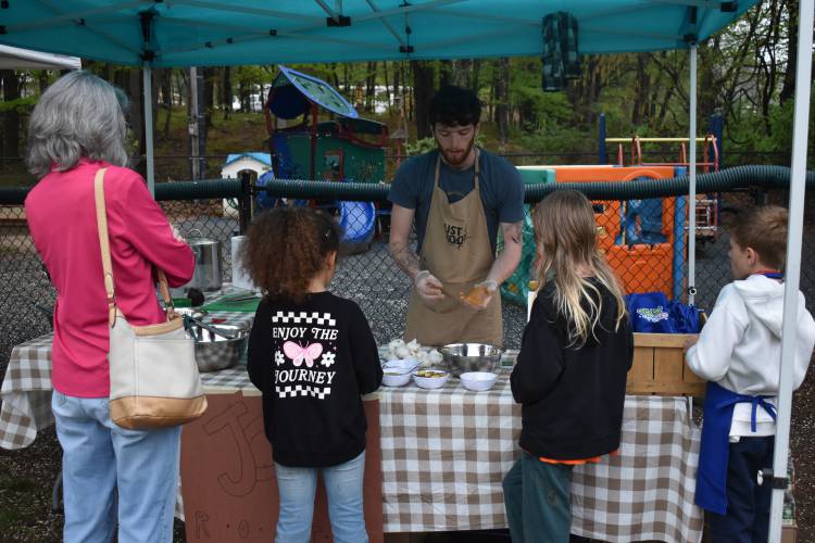 Kyle Zegel, Just Roots’ community support coordinator, held hands-on demonstrations at the third annual Spring Fling event at Conway Grammar School.