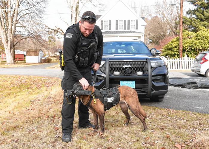 Orange Police Officer Christopher Bisceglia with retired K-9 Orka.