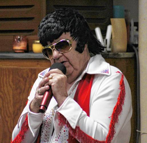 Elvis impersonator Denis Cormier performs at the First Universalist Church of Orange during Starry Starry Night on New Year’s Eve.