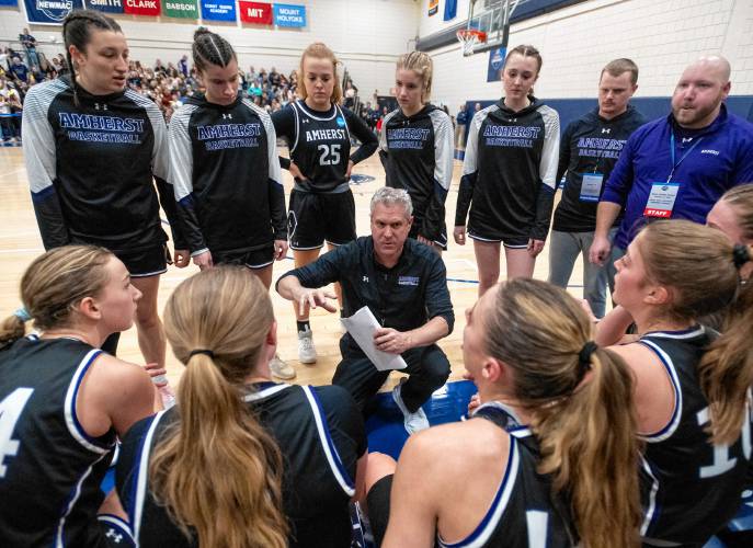 Amherst Head Coach G.P. Gromacki talks to the team during the NCAA Division 3 Women's Basketball tournament Round of 32 game against Smith at Ainsworth Gym, Saturday, March 8, 2025, in Northampton.