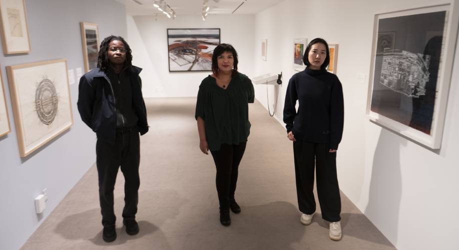 From left, Adeyemi Adebayo, Eva Barajas and Bo Kim, curators of the show “(Off)Balance: Art in the Age of Human Impact,” at the University Museum of Contemporary Art at UMass Amherst. The three are MFA candidates at the school and started working on the exhibition last July.