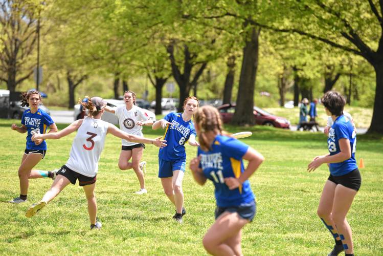 Four Rivers’ Sylvia Guillaume (8) makes a pass against Cumberland in the Four Rivers Ultimate Tournament in Greenfield Saturday.