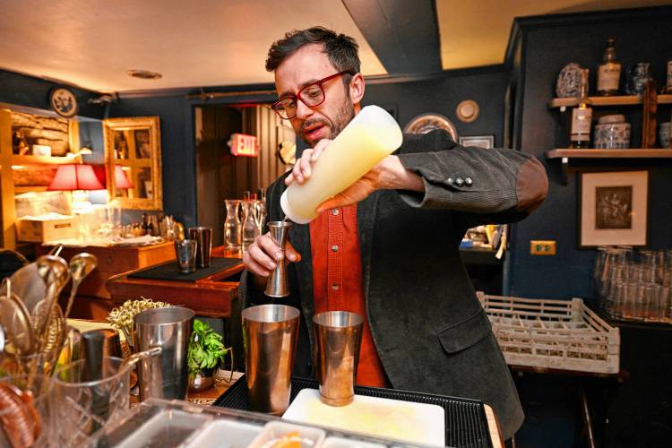 Le Peacock nighttime manager and sommelier Eric Trabucco makes a Gin Blossom.