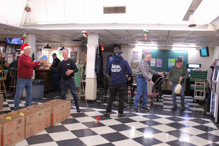 Greenfield Elks Lodge members assembled and delivered 50 Christmas meal boxes to residents in need on Saturday morning.