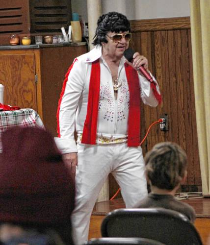 Elvis impersonator Denis Cormier performs at the First Universalist Church of Orange during Starry Starry Night on New Year’s Eve.