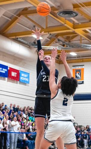 Amherst forward Maya Cwalina (21) attempts a shot over Smith forward Jazmyn Washington (2) during the NCAA Division 3 Women's Basketball tournament Round of 32 game at Ainsworth Gym, Saturday, March 8, 2025, in Northampton.