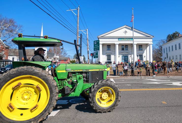 Farmers drive their tractors to Hadley Town Hall for  an “Attack on Small Farms” rally Sunday in front of Hadley Town Hall. Some 300 farmers from throughout the region were protesting proposed cuts and funding freezes involving the U.S. Department of Agriculture.