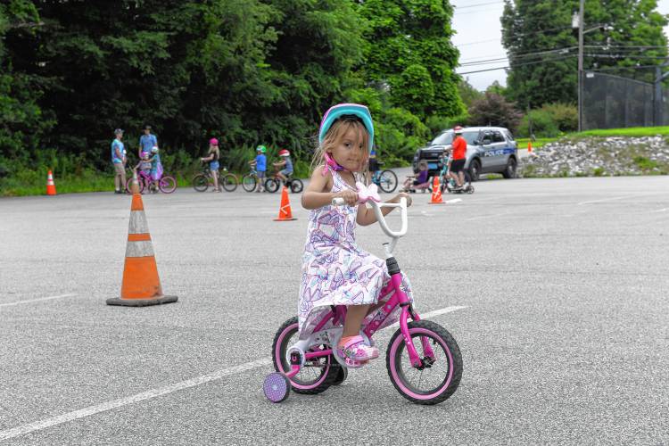 Alayna Baez, 5, rides her bike during a bicycle rodeo at Northfield Elementary School on Wednesday sponsored by the Northfield Recreation Commission’s Summer Program.