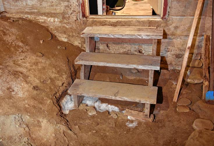 What appears to be mold growing on the dirt floor in the Ashfield Town Hall.
