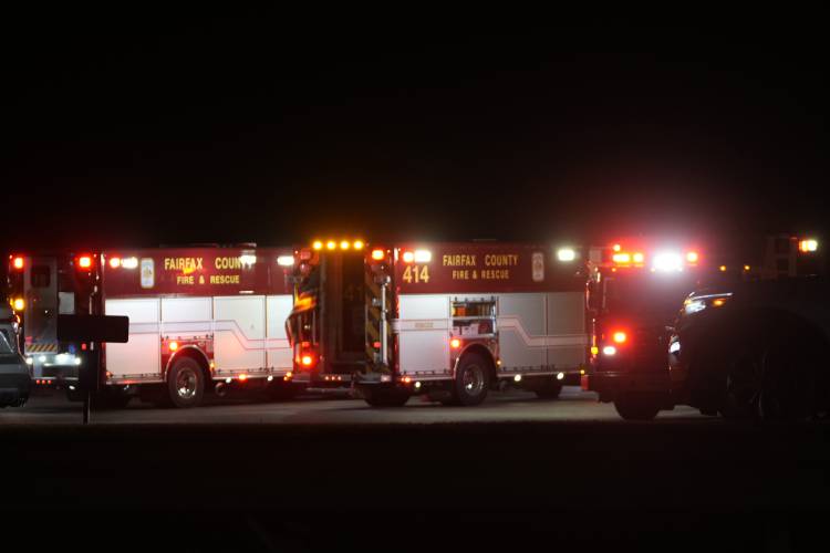 Emergency equipment stages at Gravelly Point, north of Ronald Reagan Washington National Airport, along the Potomac River, Wednesday, Jan. 29, 2025, in Arlington, Va. (AP Photo/Mark Schiefelbein)