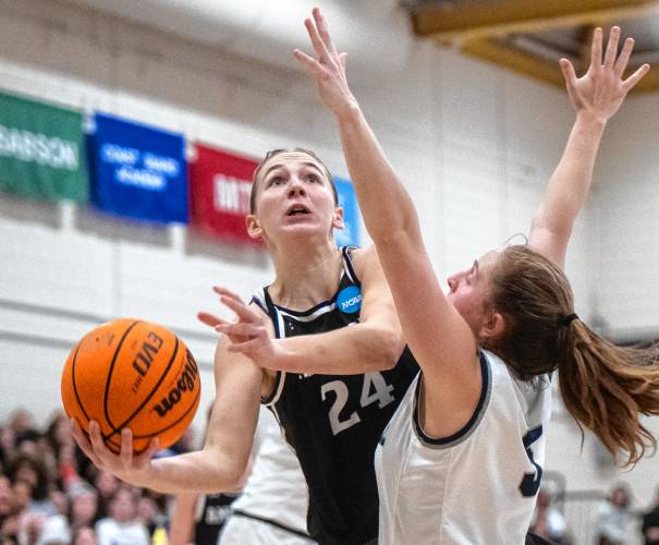 Amherst forward Brielle Renwick (24) attempts a layup past Smith guard Ally Landau, right, during the NCAA Division 3 Women's Basketball tournament Round of 32 game at Ainsworth Gym, Saturday, March 8, 2025, in Northampton.