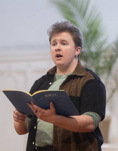UMass senior Francis Schuman sings during rehearsal for the 2025 UMass Bach Festival and Symposium.