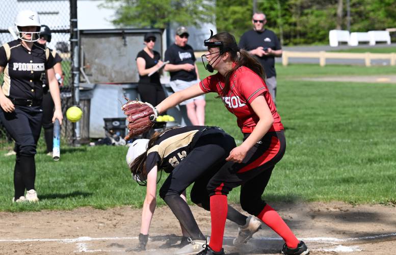 Pioneer’s Dasia Young scores on a passed ball as Athol pitcher Ella Reed waits for the throw in Northfield on Tuesday.