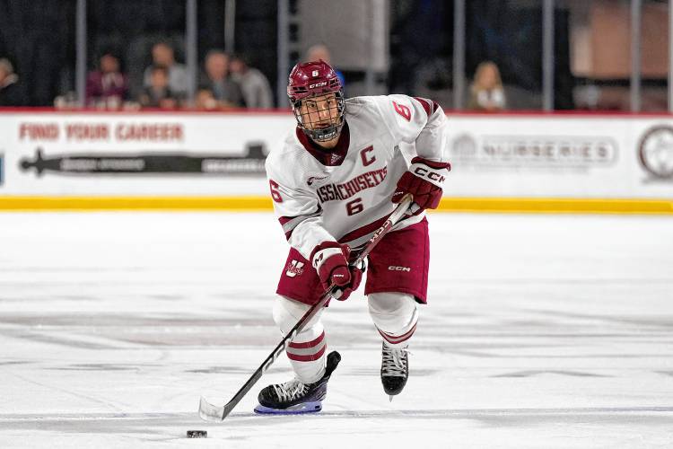 UMass defenseman Ryan Ufko carries the puck against UConn earlier this season. 