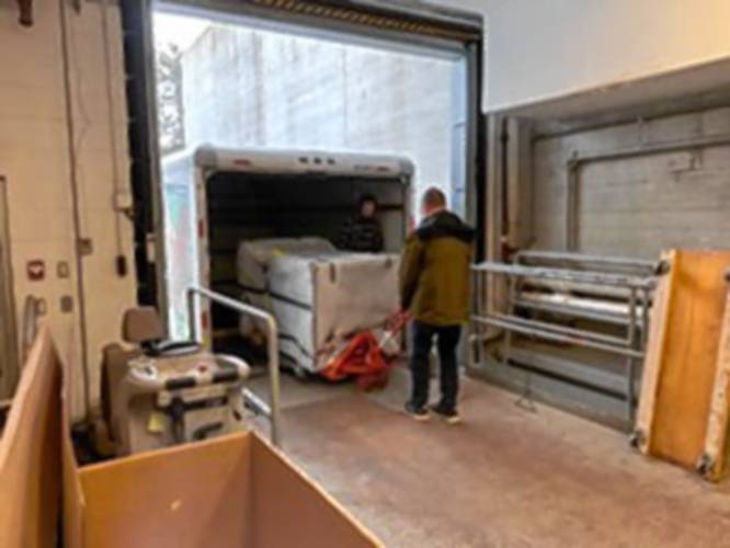 The historic guideboard on the Shutesbury town common arrives at a Williamstown conservator.