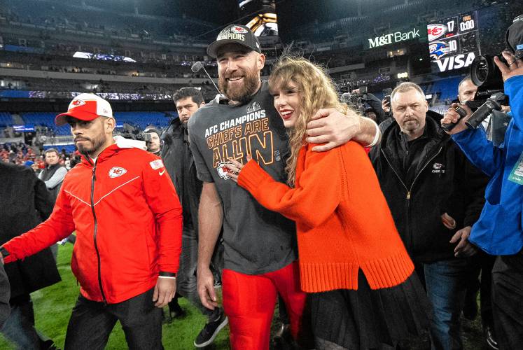 Kansas City Chiefs tight end Travis Kelce and Taylor Swift walk together after an AFC Championship game between the Chiefs and the Baltimore Ravens on Jan. 28 in Baltimore. Kansas City Chiefs tight end Travis Kelce and Taylor Swift walk together after an AFC Championship game between the Chiefs and the Baltimore Ravens on Jan. 28 in Baltimore.