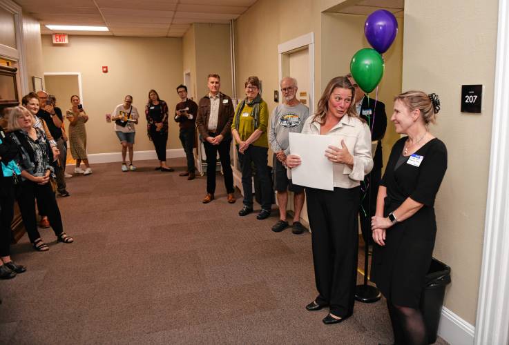 Colleen Kucinski, at right, executive director of The Literacy Project in Greenfield, is joined by state Rep. Natalie Blais as they welcome people during an open house at The Literacy Project’s new location at 278 Main St., Suite 202, in Greenfield on Monday.