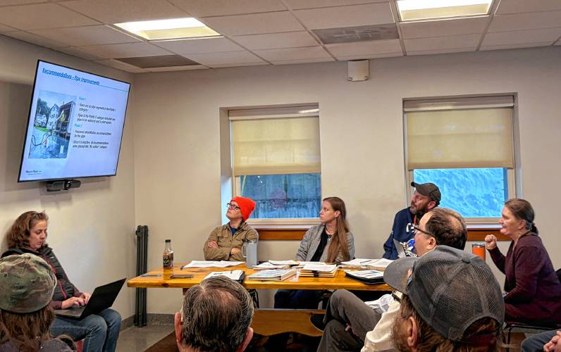 Members of the Colrain Selectboard and Colrain Sewer District board of directors review a presentation on the sewer system condition from Wright-Pierce engineers on Tuesday. Members of the Colrain Selectboard and Colrain Sewer District board of directors review a presentation on the sewer system condition from Wright-Pierce engineers on Tuesday.