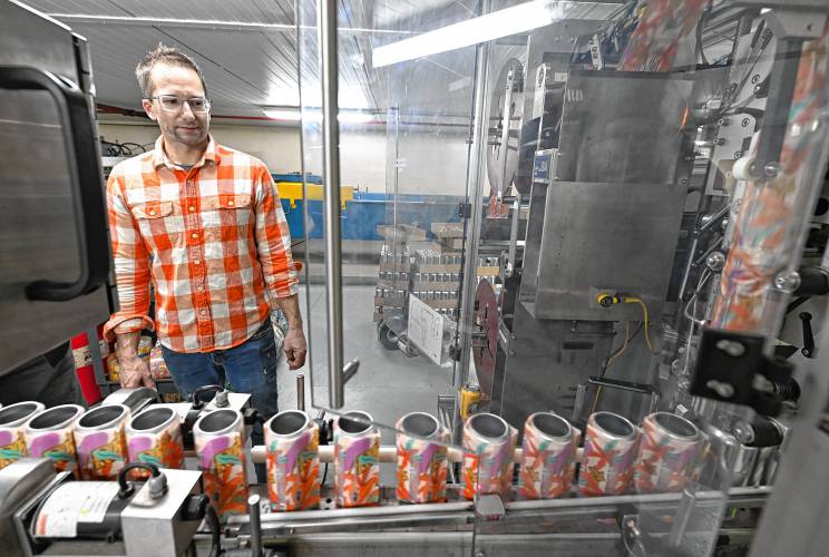 John Wilkes Jr., director of production at Berkshire Brewing Co. in South Deerfield, monitors the aluminum-canning machine.