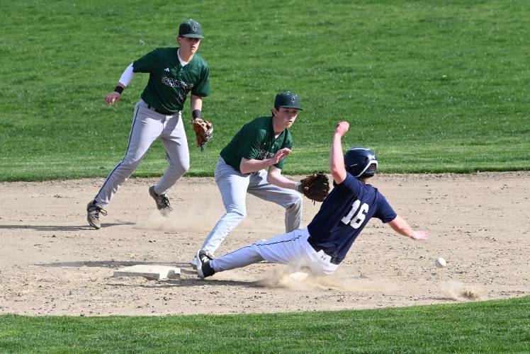 Frontier’s Porter Hall is safe at second as Greenfield’s Conner Bergeron misses the throw but is backed up by Arthur Fitzpatrick at Veterans Field in Greenfield on Thursday. 