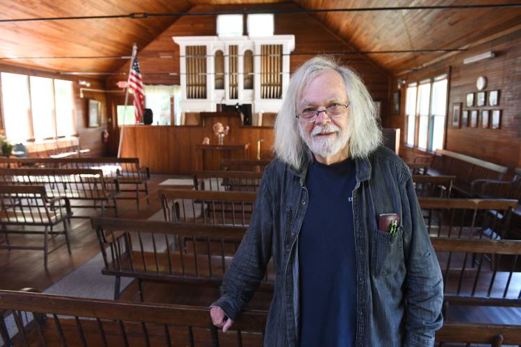 Vice President and acting CEO David James, pictured in August 2024 inside The National Spiritual Alliance’s temple in the Lake Pleasant, which is reopening.