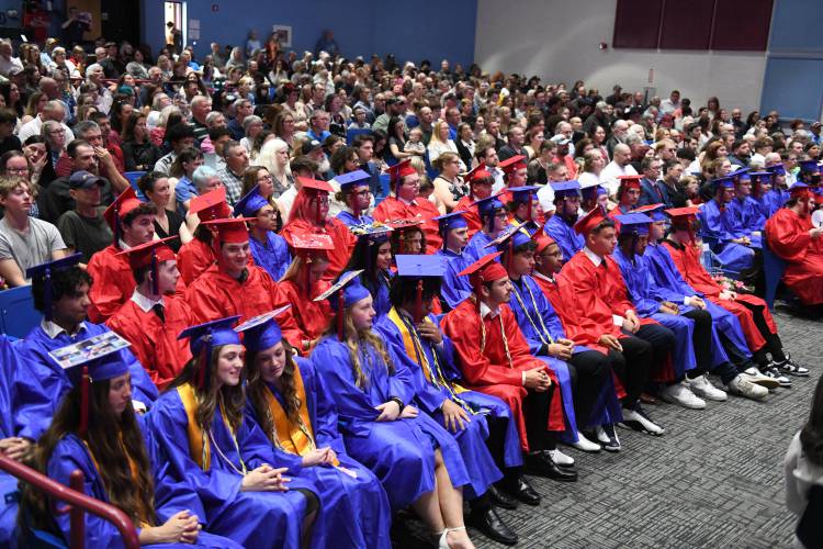 Seniors listen to speakers at commencement exercises at Ralph C. Mahar Regional School Friday evening.