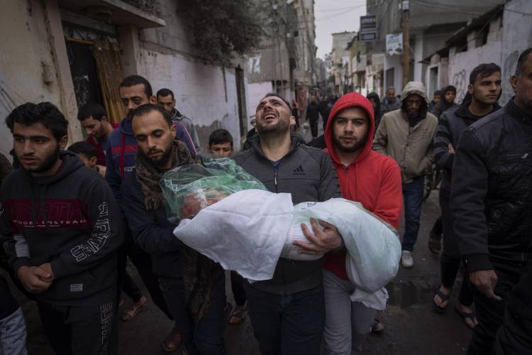 Mohammad Shouman carries the body of his daughter, Masa, who was killed in an Israeli bombardment of the Gaza Strip, during her funeral in Rafah, southern Gaza, Wednesday, Jan. 17, 2024. (AP Photo/Fatima Shbair) Mohammad Shouman carries the body of his daughter, Masa, who was killed in an Israeli bombardment of the Gaza Strip, during her funeral in Rafah, southern Gaza, Wednesday, Jan. 17, 2024. (AP Photo/Fatima Shbair)