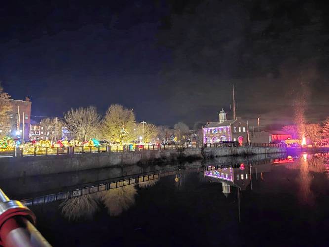Holiday lights at Memorial Park, the Fire Station and the bonfire behind the station illuminate Orange during Starry Starry Night on New Year’s Eve.