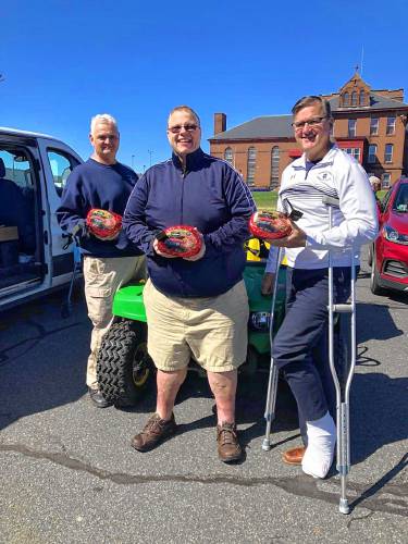 Franklin County TRIAD Officer Ray Zukowski, DJ Robert “Bobby C” Campbell and Franklin County Sheriff Christopher Donelan hold hams donated to area senior centers in 2021. Money is being collected now for the eighth annual Franklin County TRIAD Hams for Seniors fundraiser. Franklin County TRIAD Officer Ray Zukowski, DJ Robert “Bobby C” Campbell and Franklin County Sheriff Christopher Donelan hold hams donated to area senior centers in 2021. Money is being collected now for the eighth annual Franklin County TRIAD Hams for Seniors fundraiser.