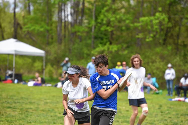 Four Rivers’ Ethan Hannon comes down with a score against PVPA in the Four Rivers Ultimate Tournament in Greenfield Saturday.