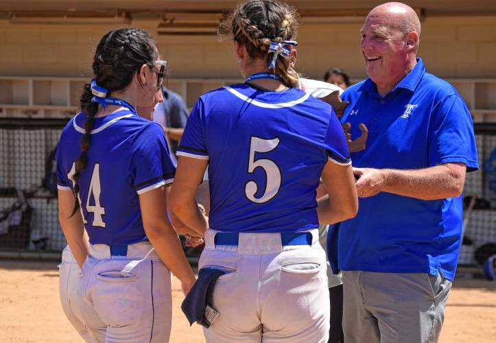 Turners Falls athletic director Adam Graves presents the state championship trophy to the Thunder’s captains following the Thunder’s 5-0 win over Georgetown in the MIAA Division 5 championship game on Saturday at Sortino Field on the campus of UMass.