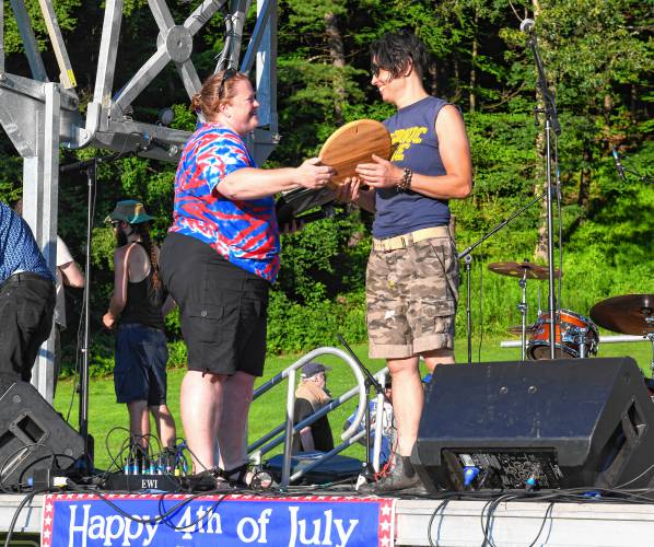 Greenfield Recreation Director Christy Moore presents Amy McMahan, owner of Mesa Verde, with the Fortin Family Award for her contributions to the community at the Independence Day celebration at Beacon Field on Sunday.