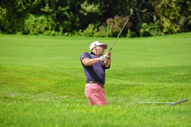 Defending champion Ben Spitz hits out of a fairway bunker on No. 9 at Ledges Golf Club in South Hadley during the 43rd Massachusetts Amateur Public Links Golf Championship on Wednesday.