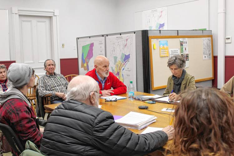 Franklin County’s YMCA CEO Grady Vigneau, in red, presents plans to bring the former Zion Korean Church back to its hometown of Barre during the Greenfield Historical Commission meeting on Thursday evening.