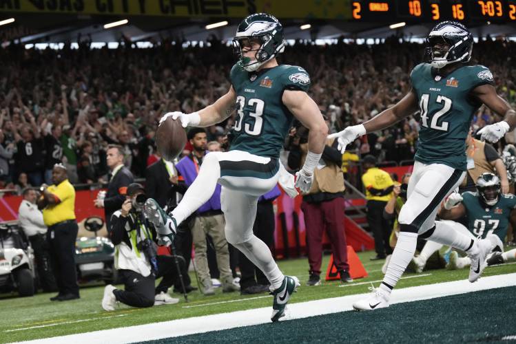 Philadelphia Eagles defensive back Cooper DeJean (33) scores a touchdown after intercepting a pass during the first half of the NFL Super Bowl 59 football game against the Kansas City Chiefs, Sunday, Feb. 9, 2025, in New Orleans. (AP Photo/George Walker IV)